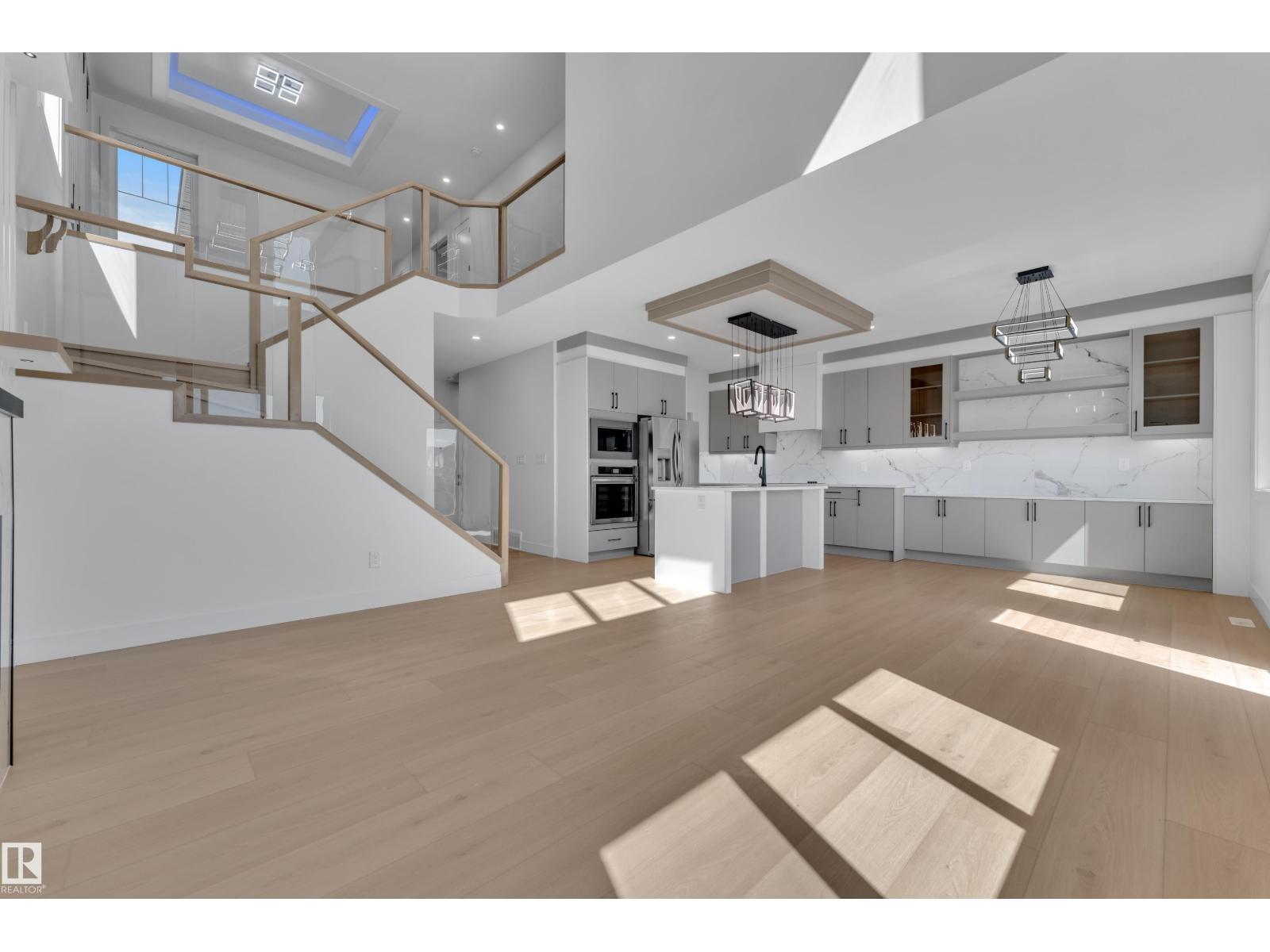 Kitchen open to staircase above