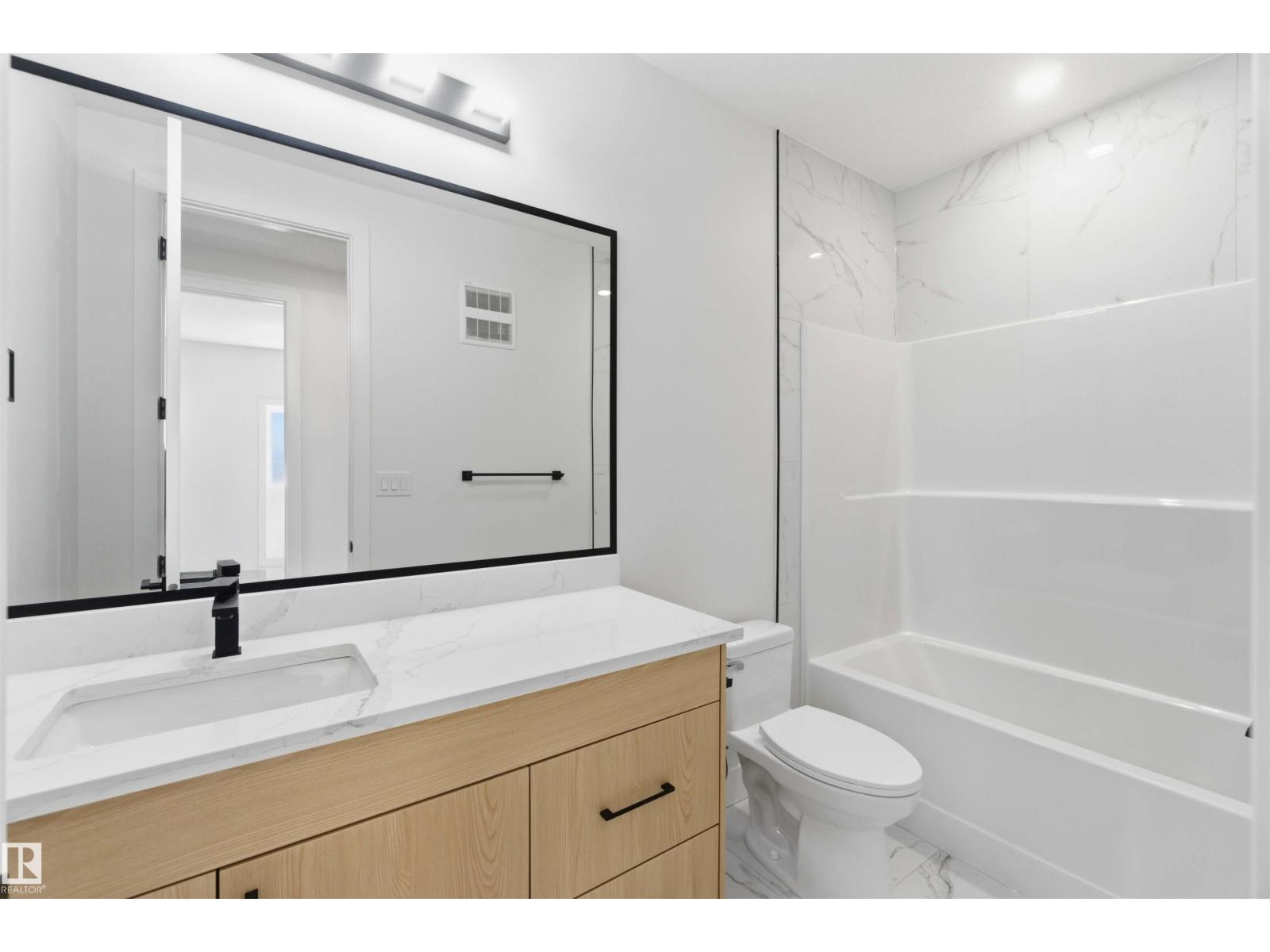 Bathroom with tub and shower combo